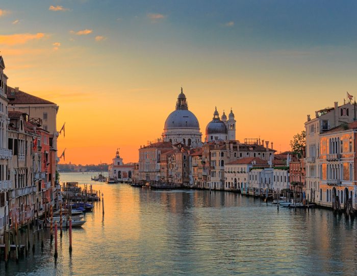 A scenic view of the Canal Grande in the town of Venice, Italy during sunset
